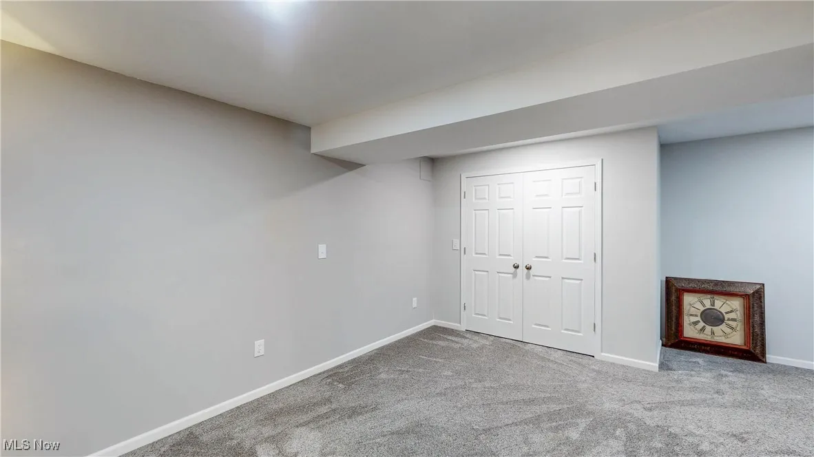 bedroom with carpet and a closet