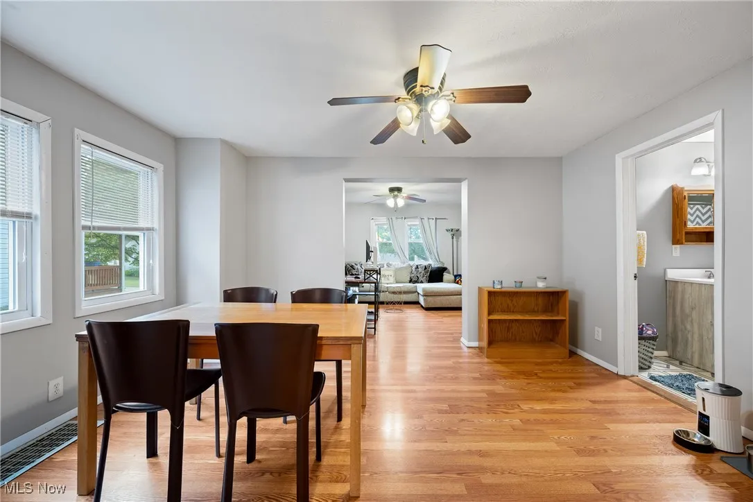 Dining area featuring light wood-style floors and ceiling fan