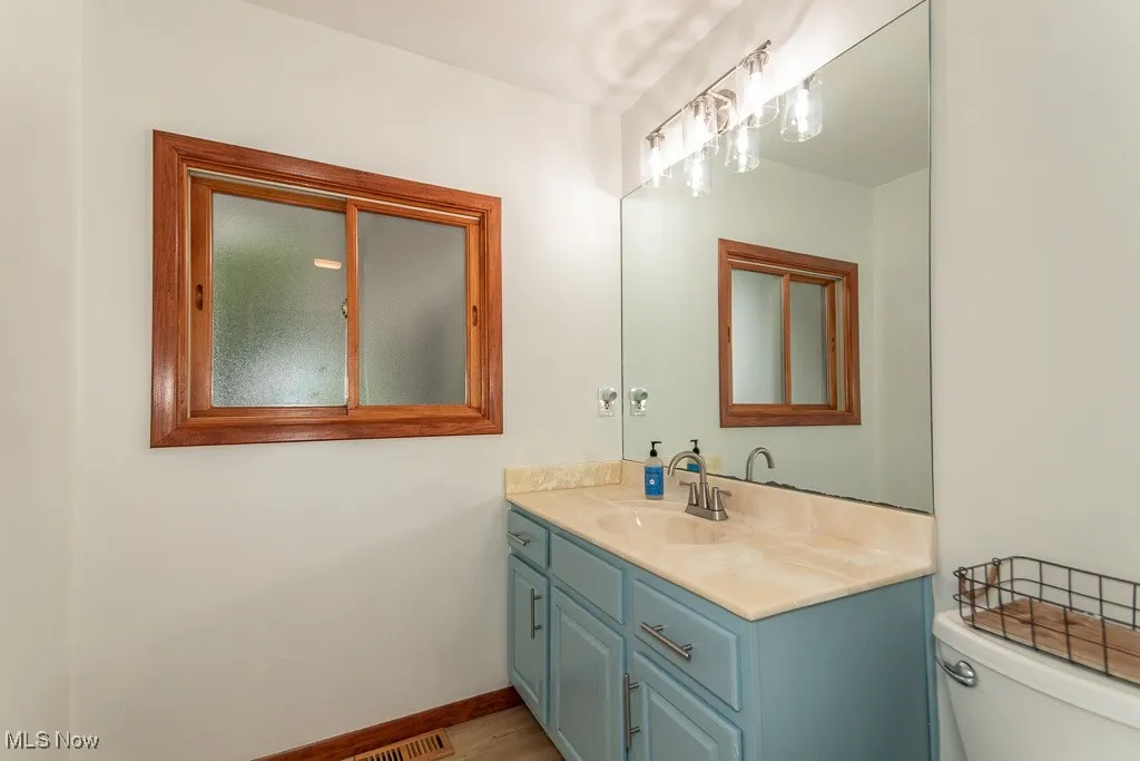 Bathroom with vanity and toilet