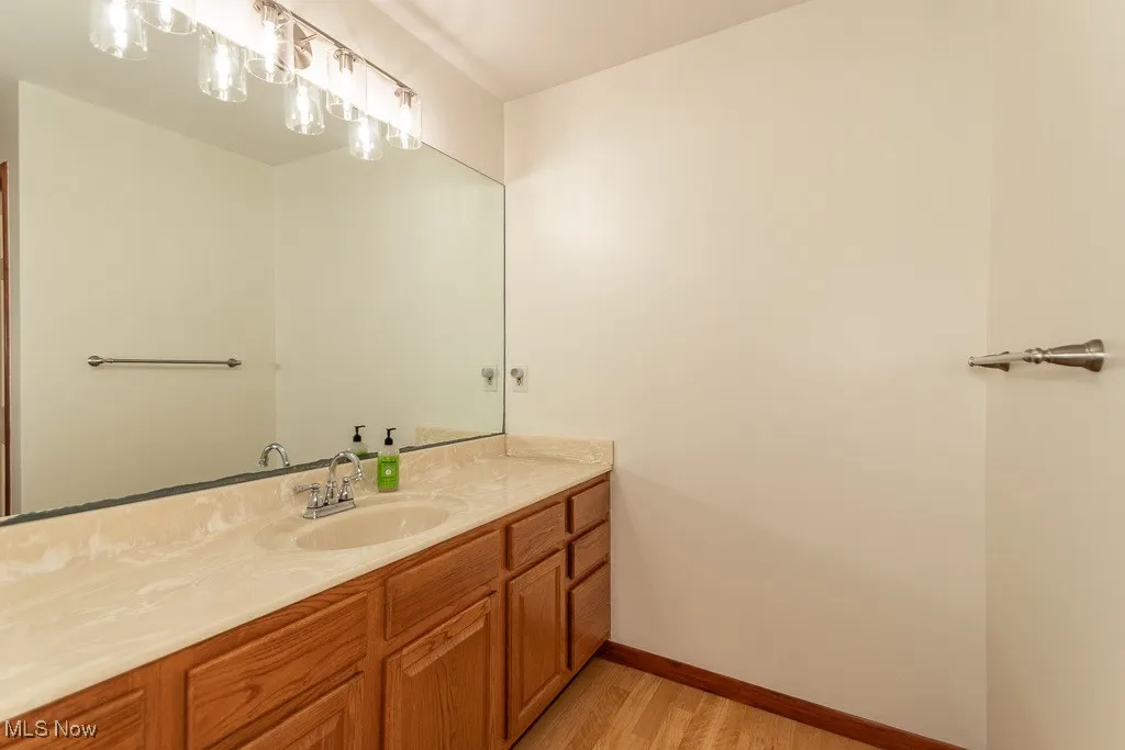 Bathroom with vanity and light wood-style floors