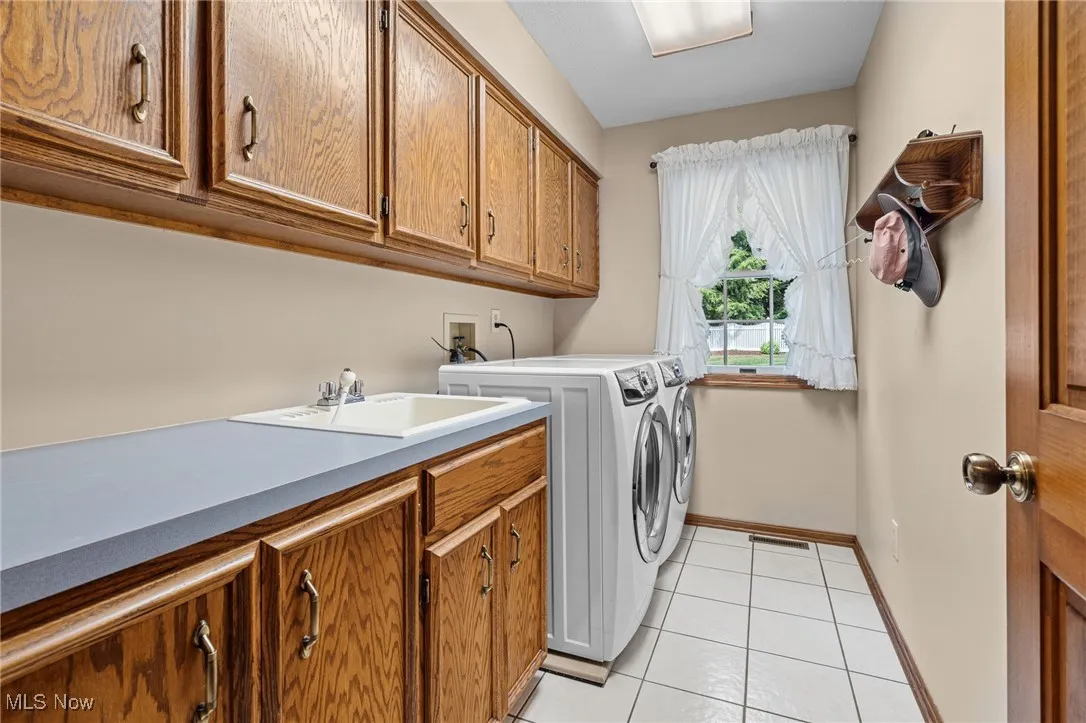 Laundry room with ample storage.