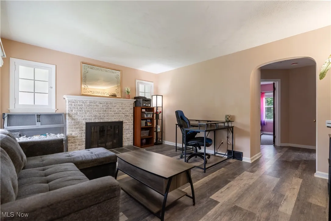 Living Room with a white brick fireplace