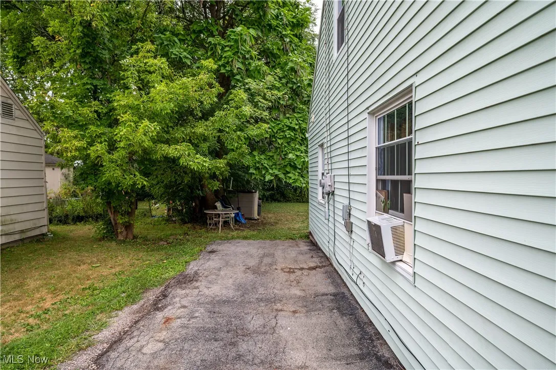 View of side of property featuring a patio