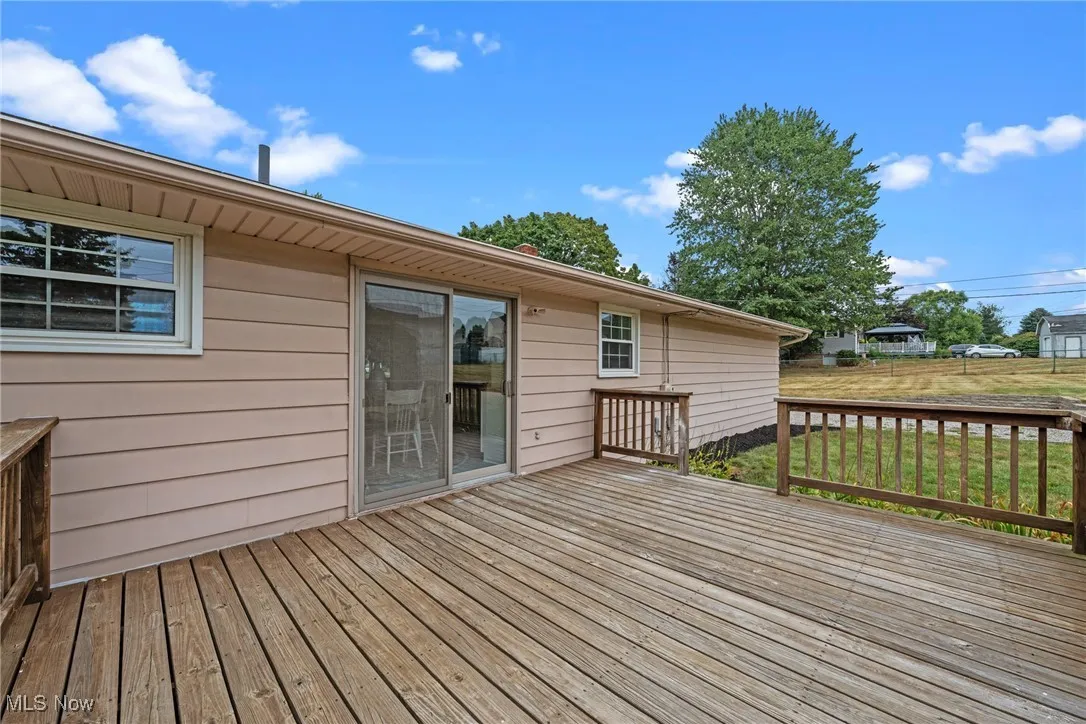 Wooden terrace with a lawn