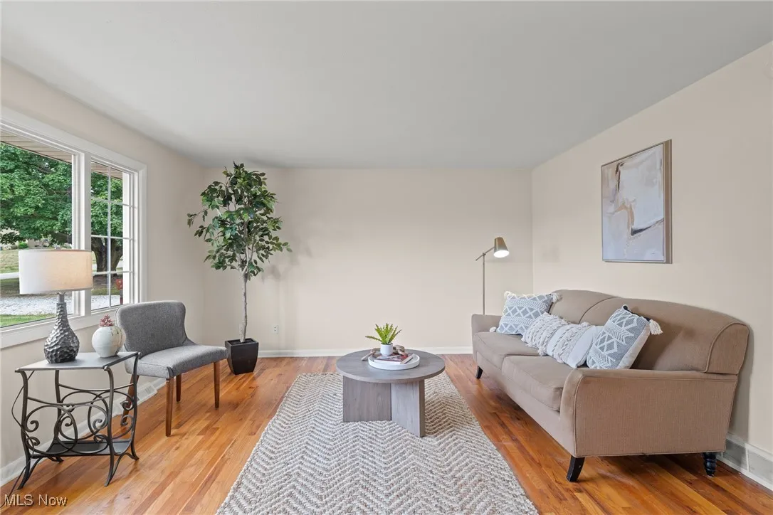 Living room with light wood-style floors