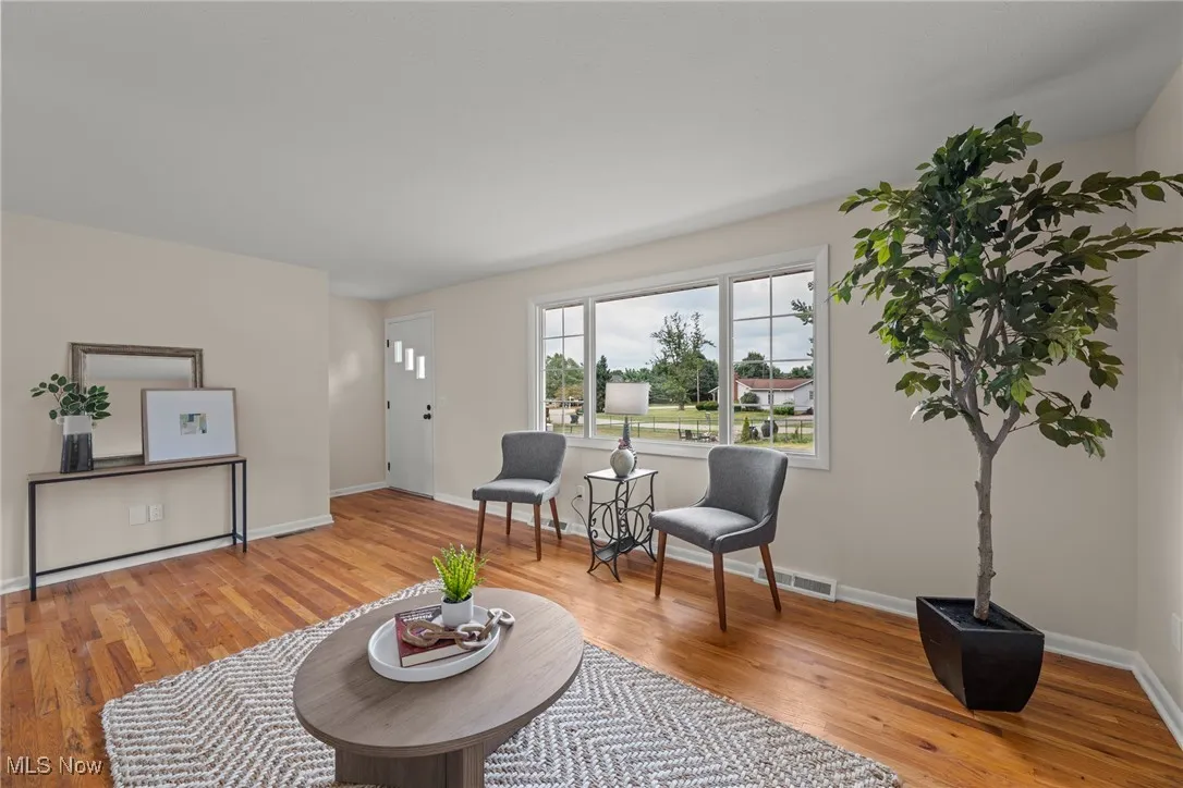 Living area with light wood-style floors