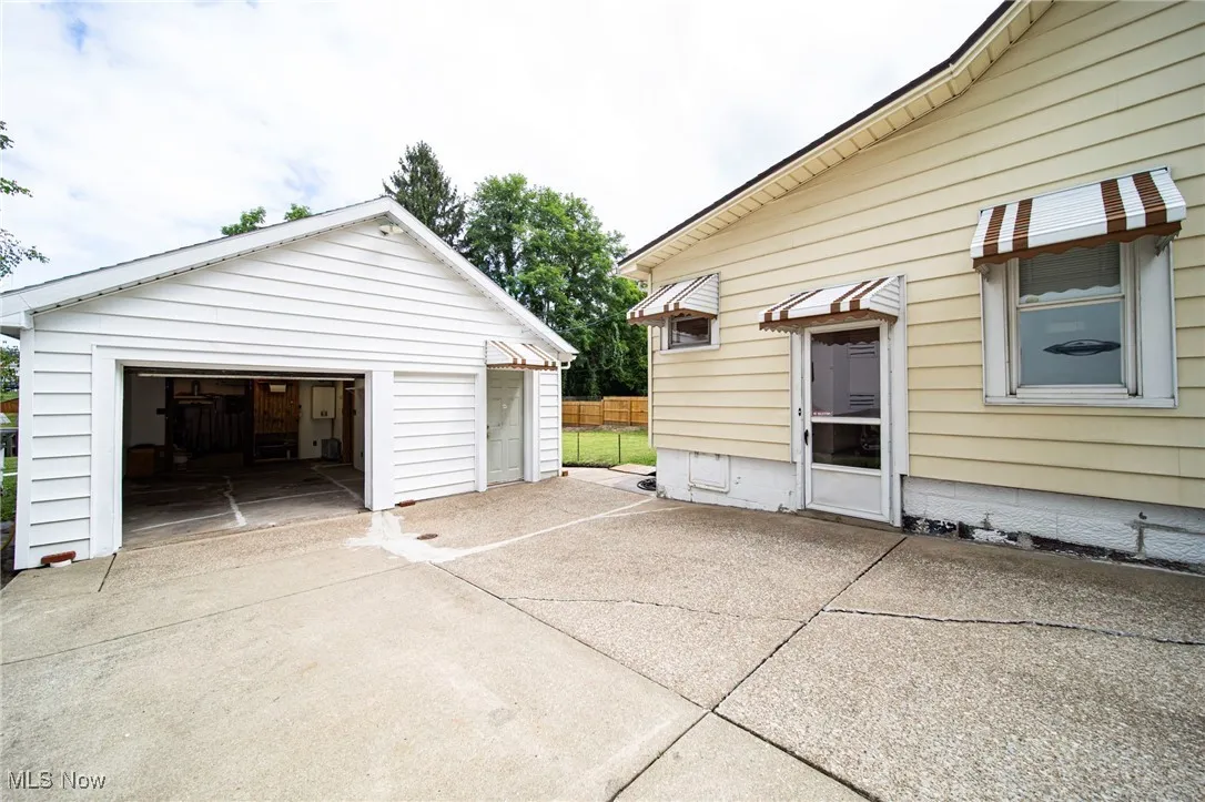 Detached garage featuring driveway