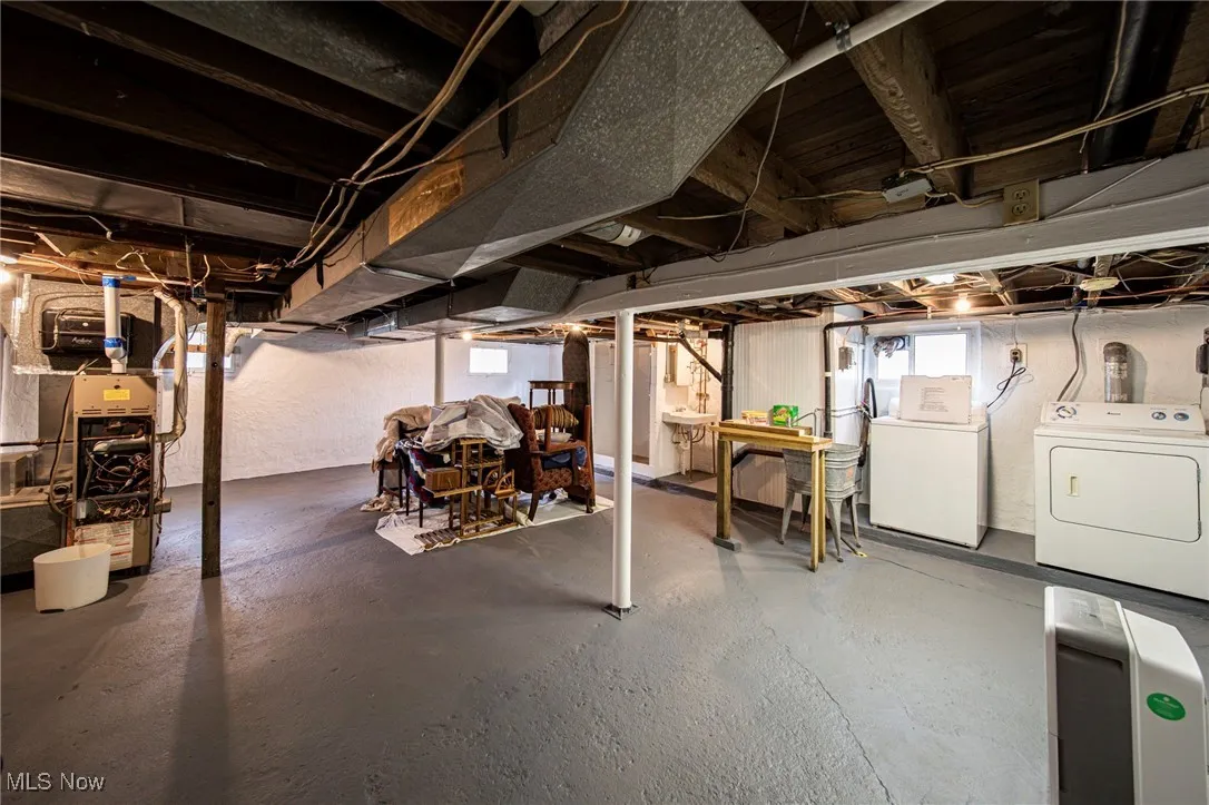 Basement featuring independent washer and dryer