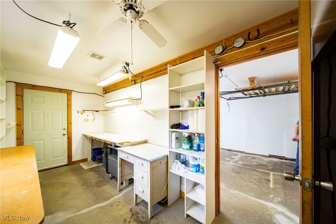 Below grade area featuring a ceiling fan