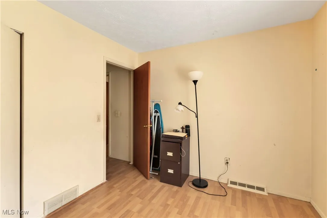 Misc room featuring light wood finished floors and baseboards