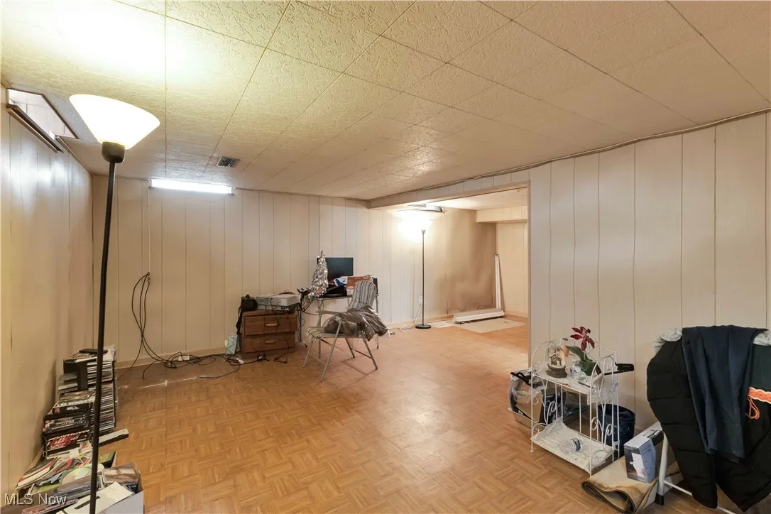 Finished below grade area featuring wood walls