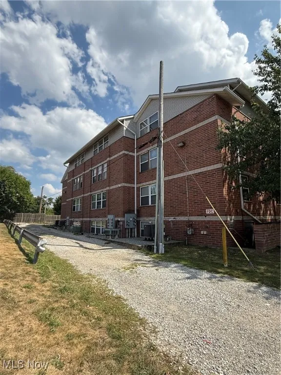 View of building exterior with driveway