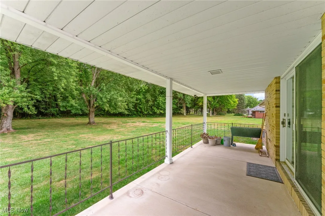 Porch featuring a yard