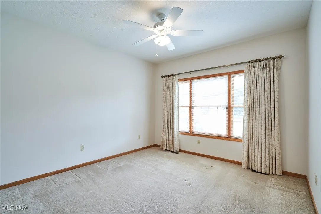 Second bedroom with large window package over looking back yard