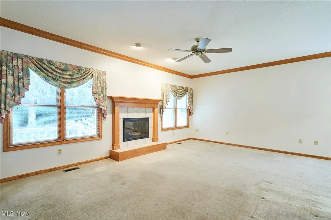 Family room with crown molding and gas log fireplace