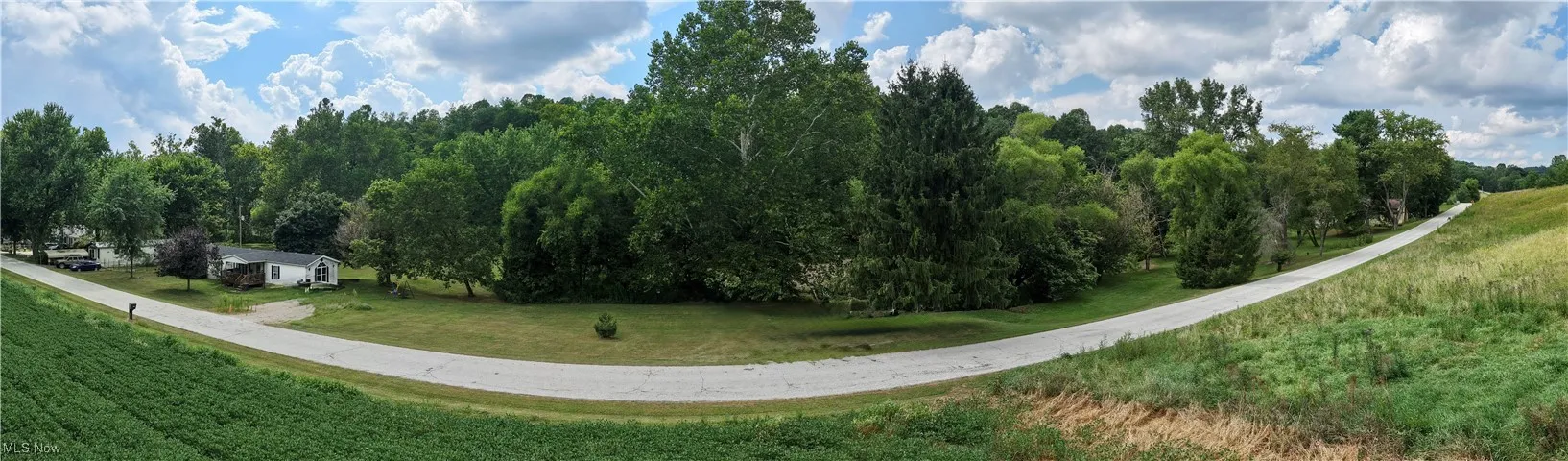 View of home's community featuring a yard