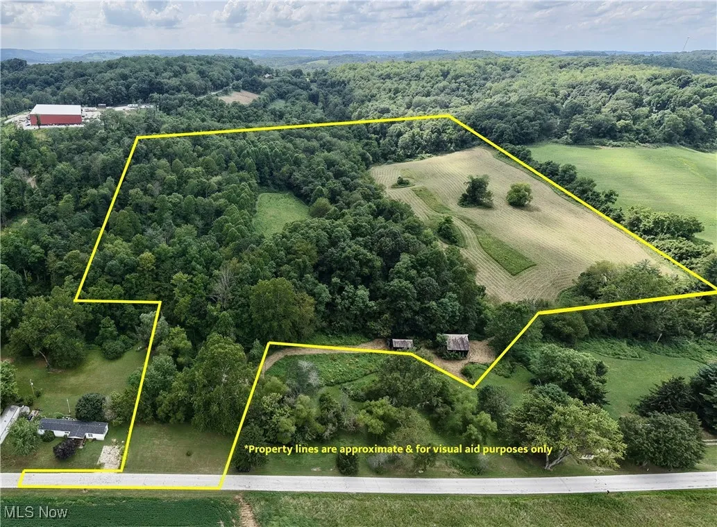 Aerial view of sparsely populated area with property boundaries highlighted and abundant farmland