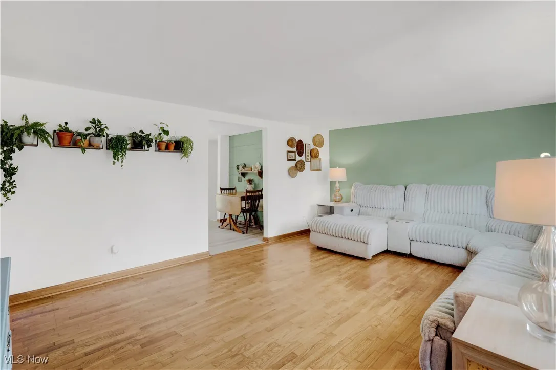 Living room with wood finished floors and baseboards