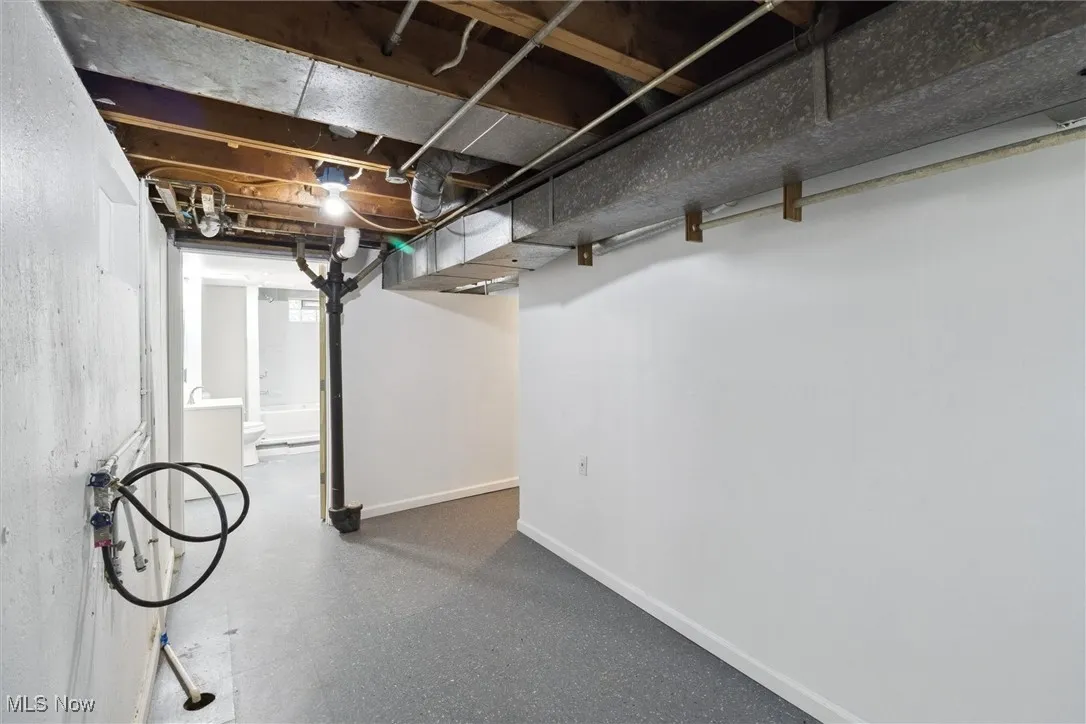 Below grade area featuring baseboards