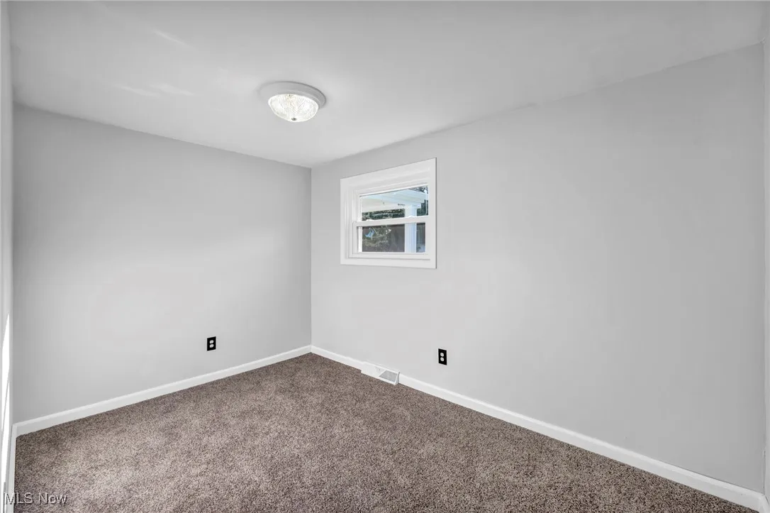 2nd Bedroom with baseboards and carpet