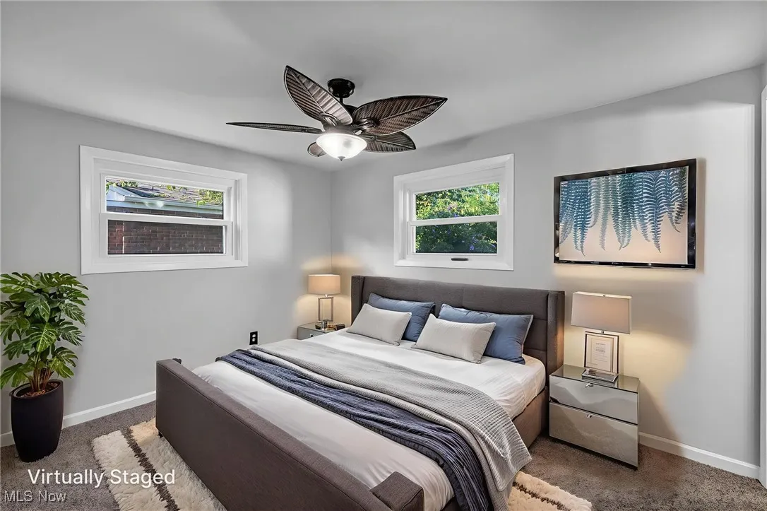 Bedroom with carpet flooring and ceiling fan