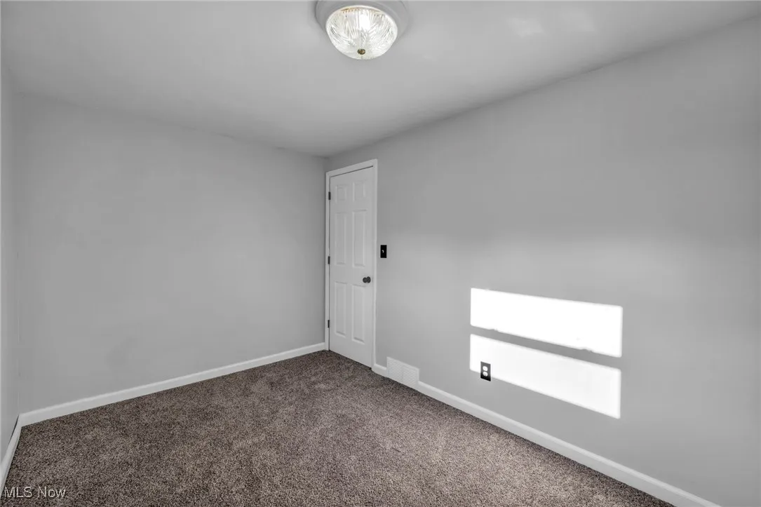 2nd Bedroom Carpeted empty room with baseboards