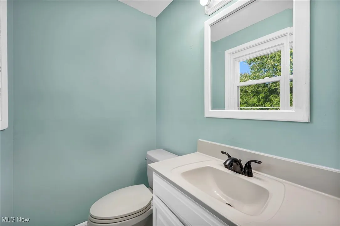 Half Bathroom off of Master bedroom  featuring vanity and toilet
