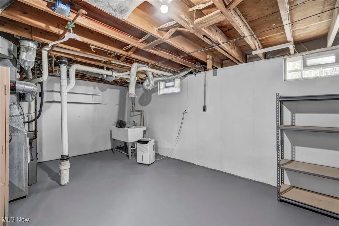 Basement featuring a sink