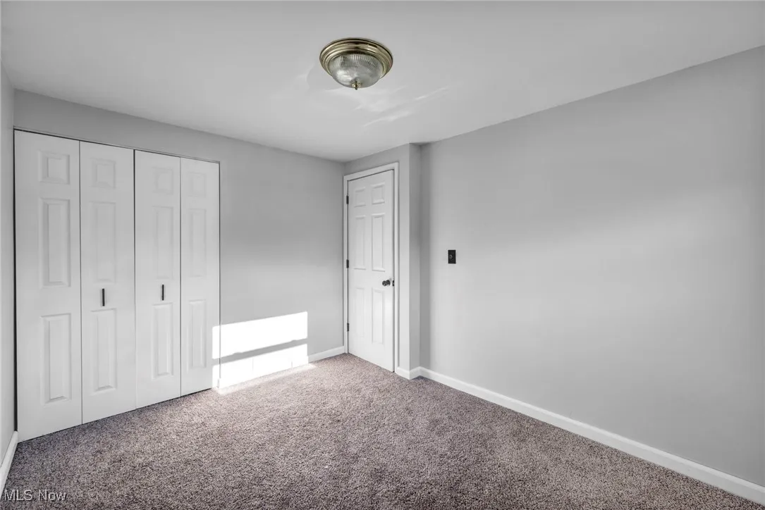 3rd Bedroom featuring carpet floors and a closet