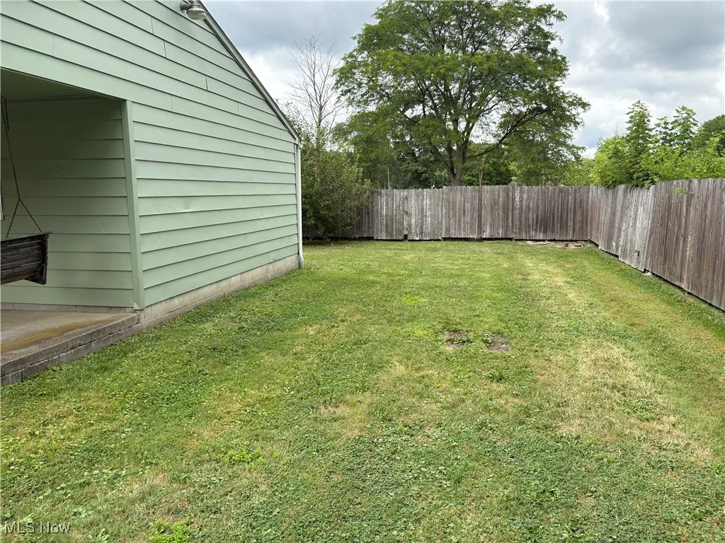 View of fenced backyard