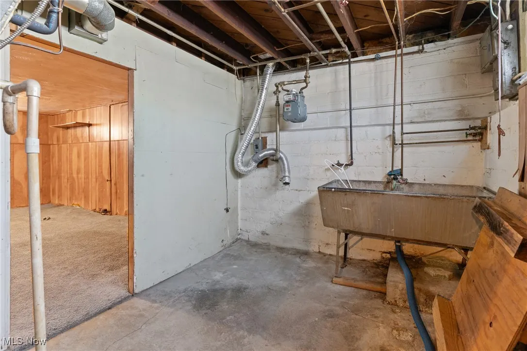 Utility room with washer, dryer hookups and utility sink