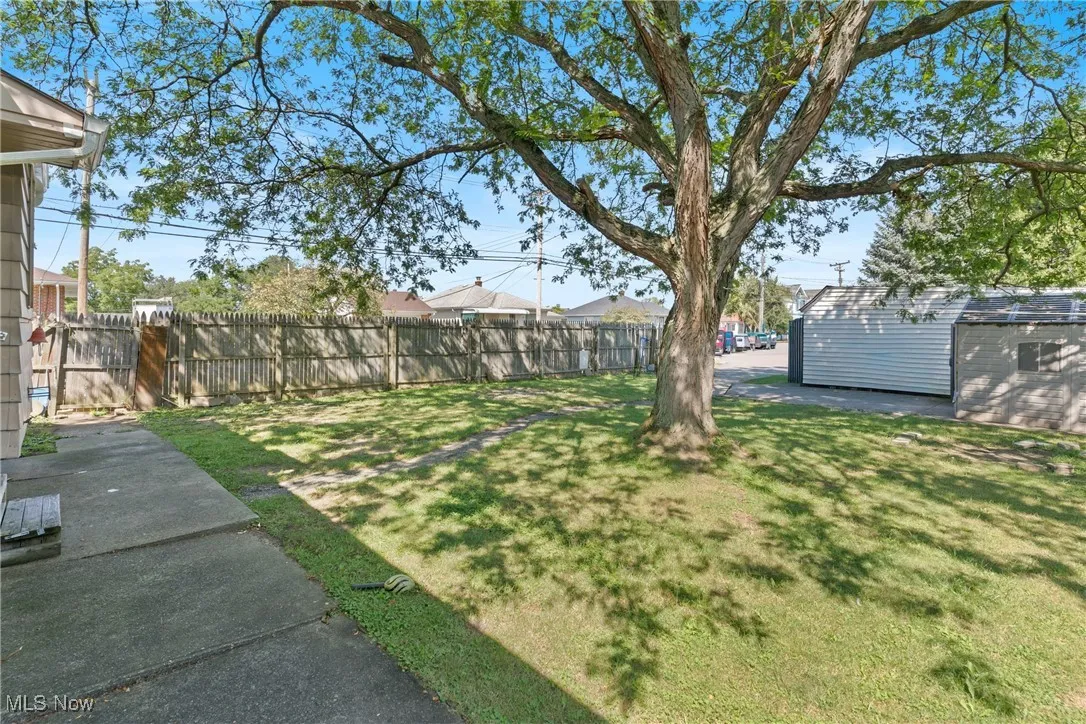 View of  fenced corner back yard