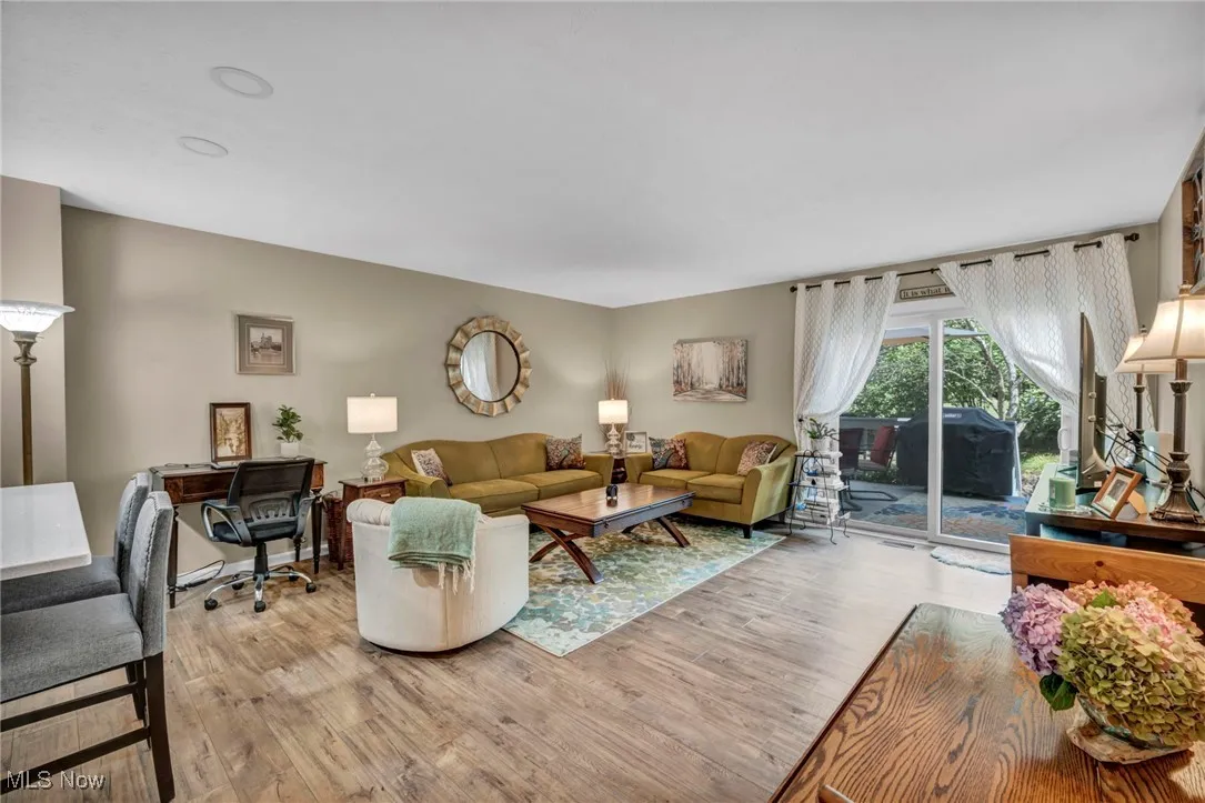 Living area, breakfast counter, updated floors and slider to wooden deck