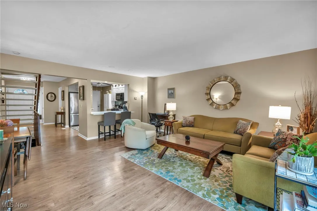 Living room with stairway, updated kitchen and floors
