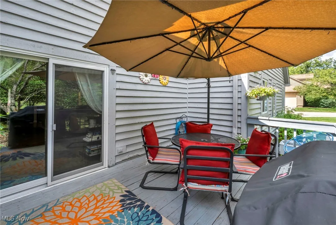 Wooden deck featuring outdoor dining area