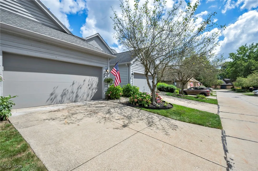 View of home's exterior with driveway and a garage