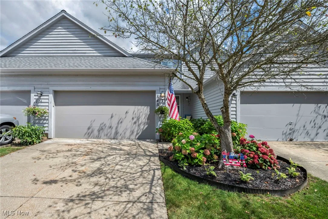 View of front of property featuring driveway, and a garage