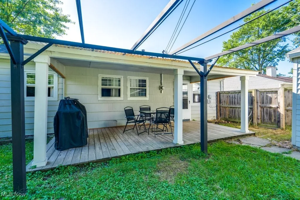 Back of house featuring a deck and outdoor dining space
