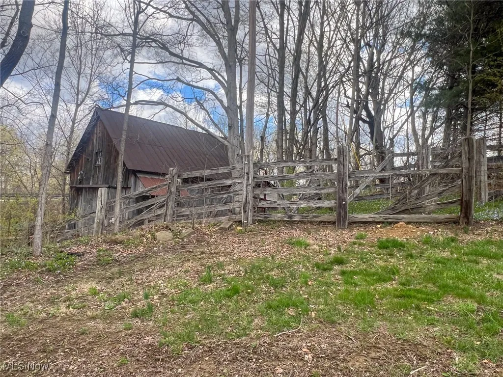 View of yard featuring an outbuilding and a barn