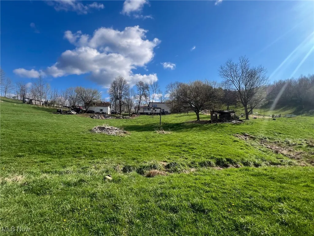 View of green lawn featuring a view of countryside