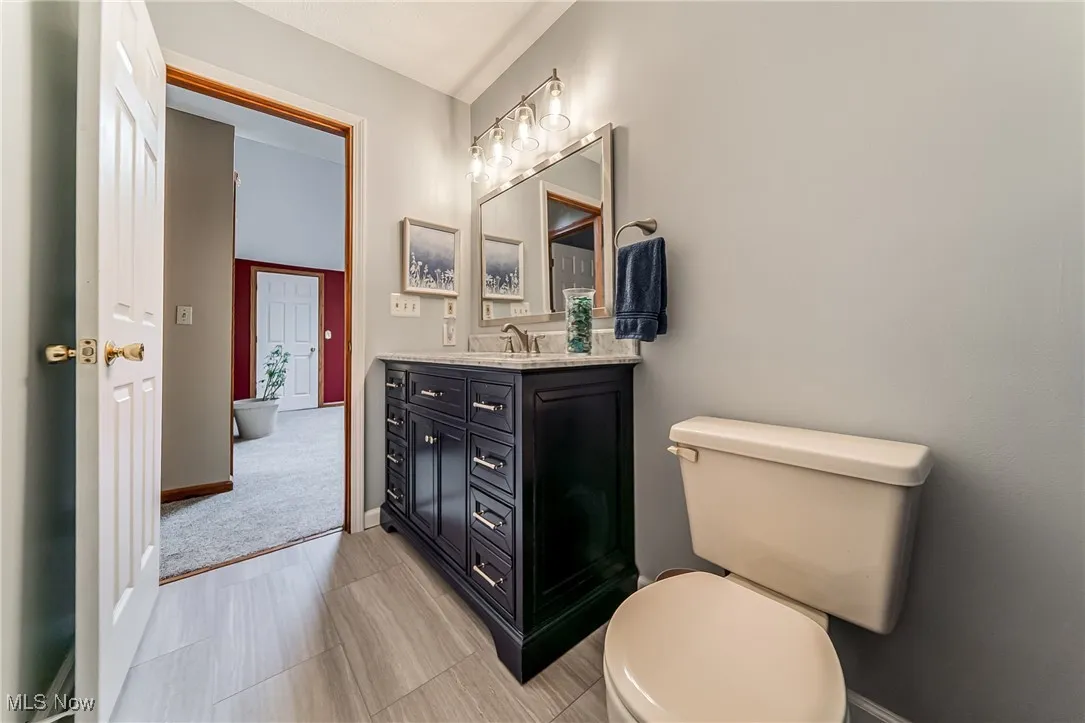 Bathroom with vanity and toilet