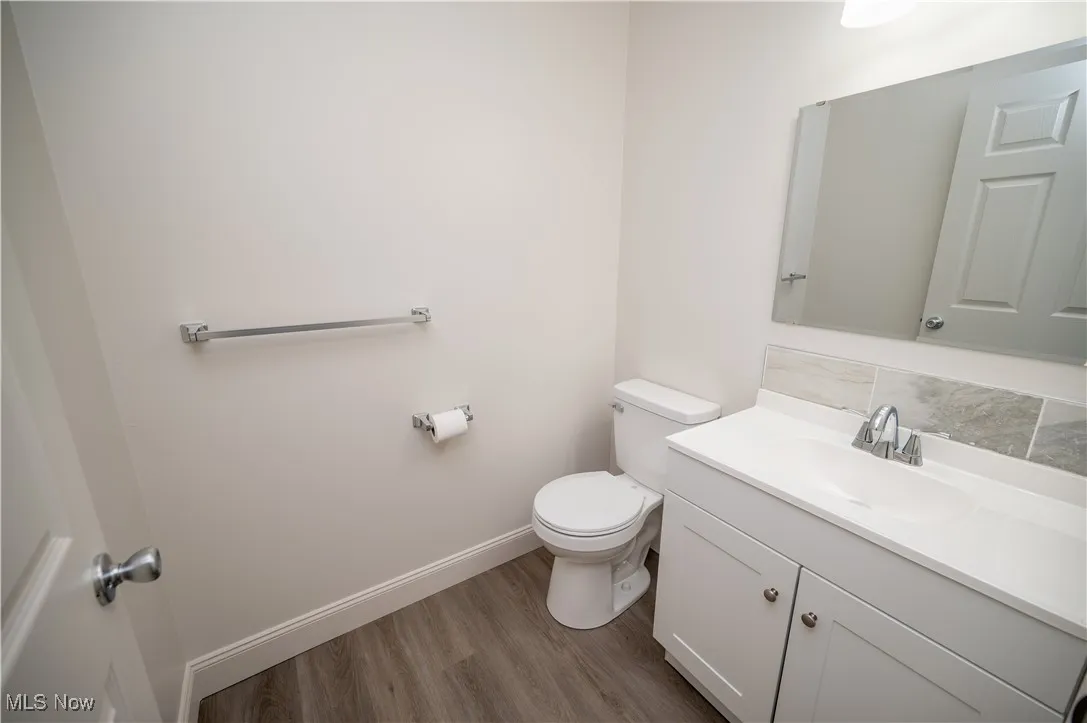 Bathroom with vanity and light wood finished floors