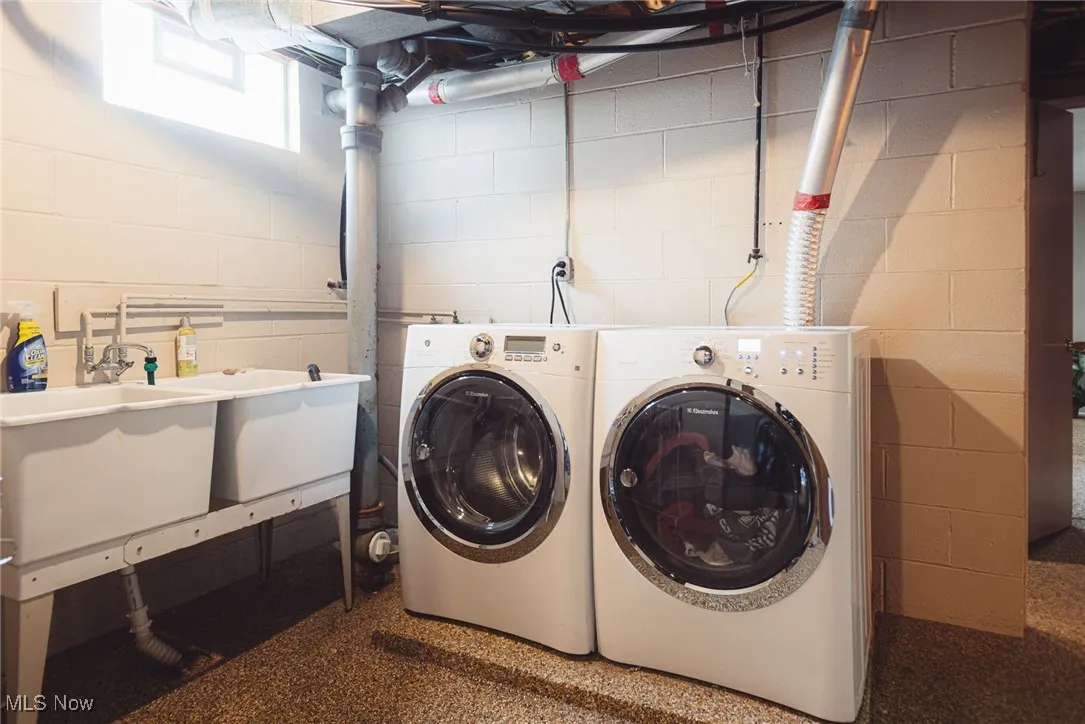 Laundry room featuring washing machine and clothes dryer