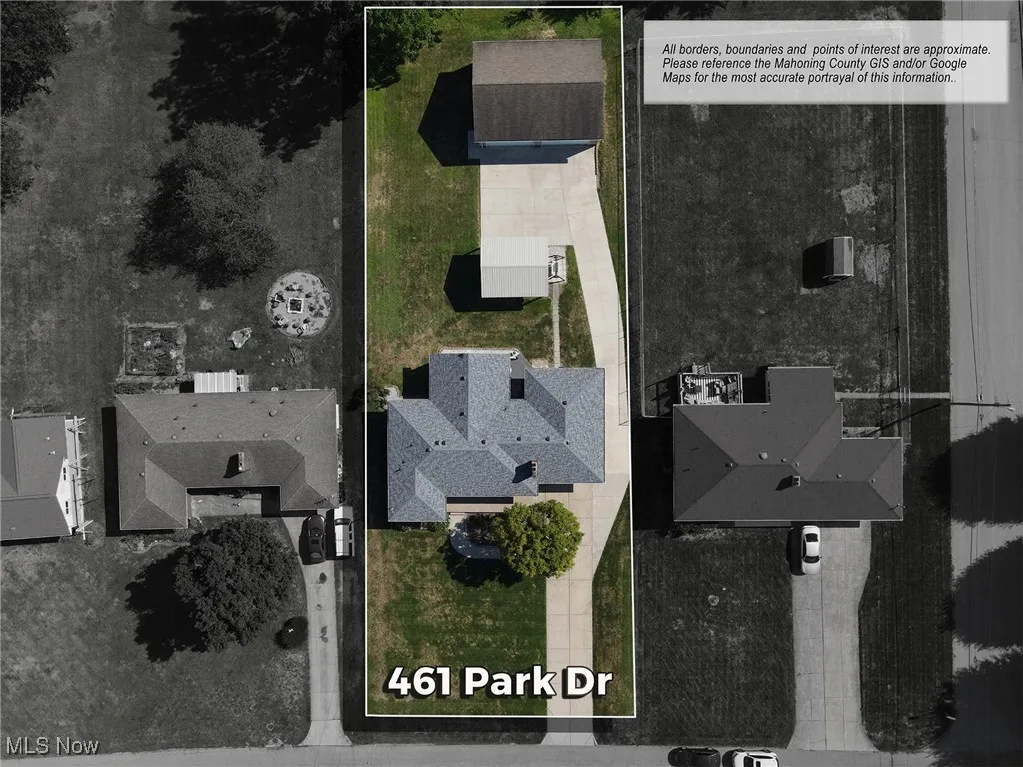 Aerial view of residential area with property boundaries highlighted