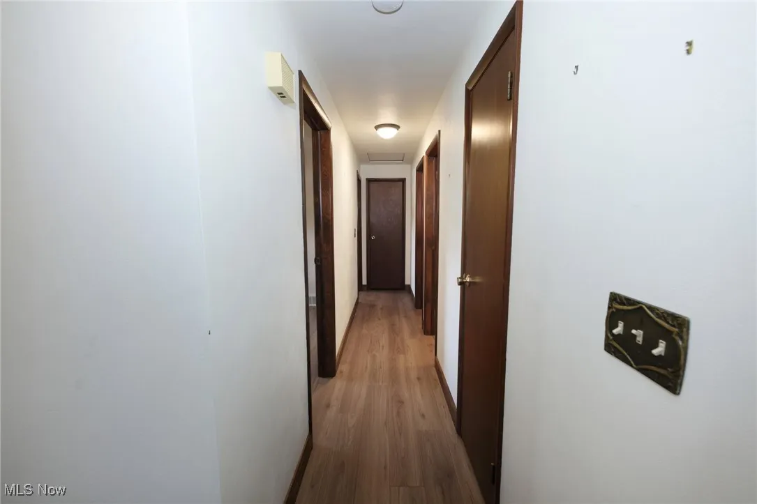 Corridor with light wood finished floors