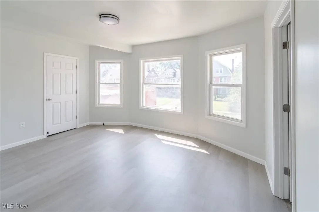Unfurnished bedroom featuring baseboards and light wood finished floors