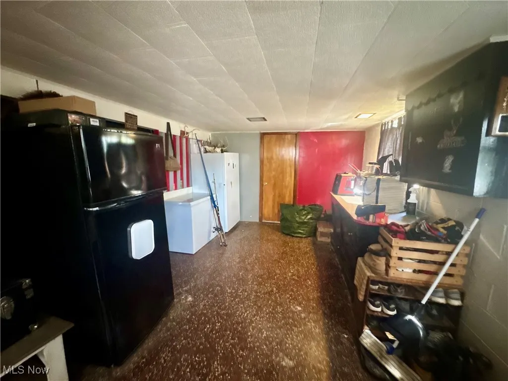 Kitchen with freestanding refrigerator