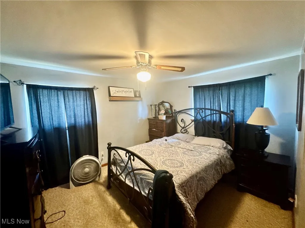 Bedroom with carpet floors and ceiling fan