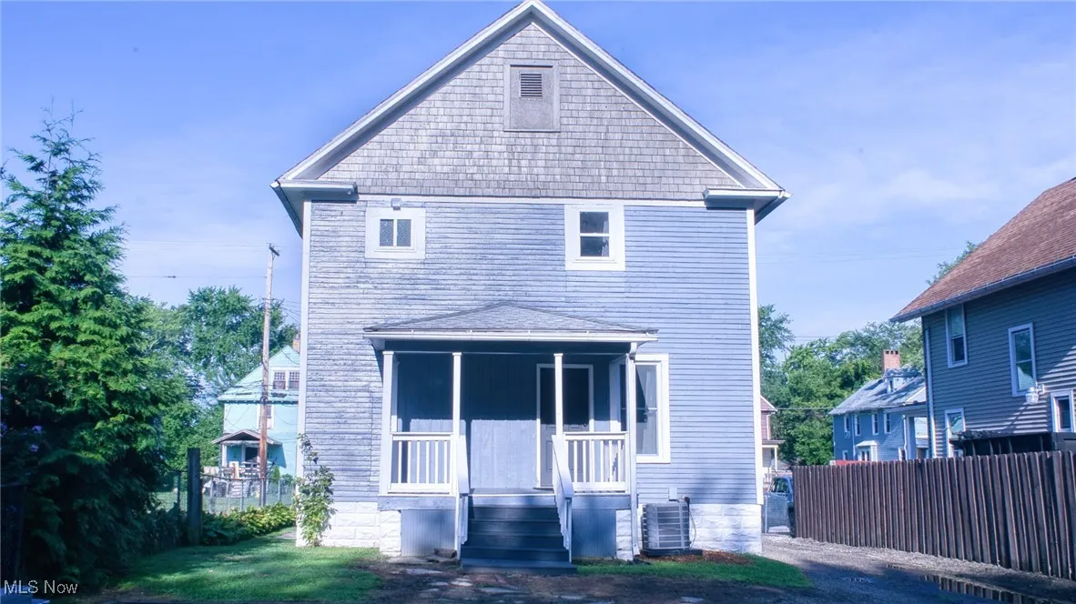 Back of property featuring a porch