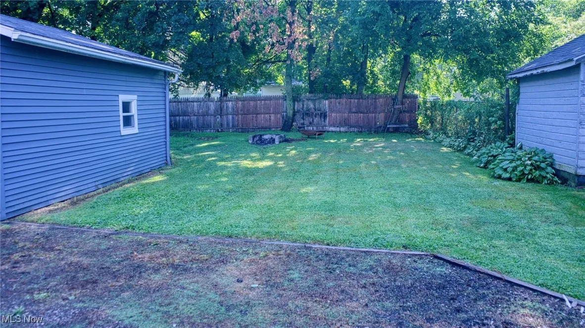 View of fenced backyard